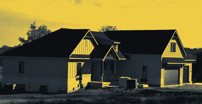 A new two-storey house with a fresh dark shingle roof